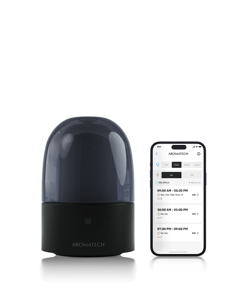 AromaDream scent diffuser on a transparent background next to phone with 168极速赛车官方开奖平台App